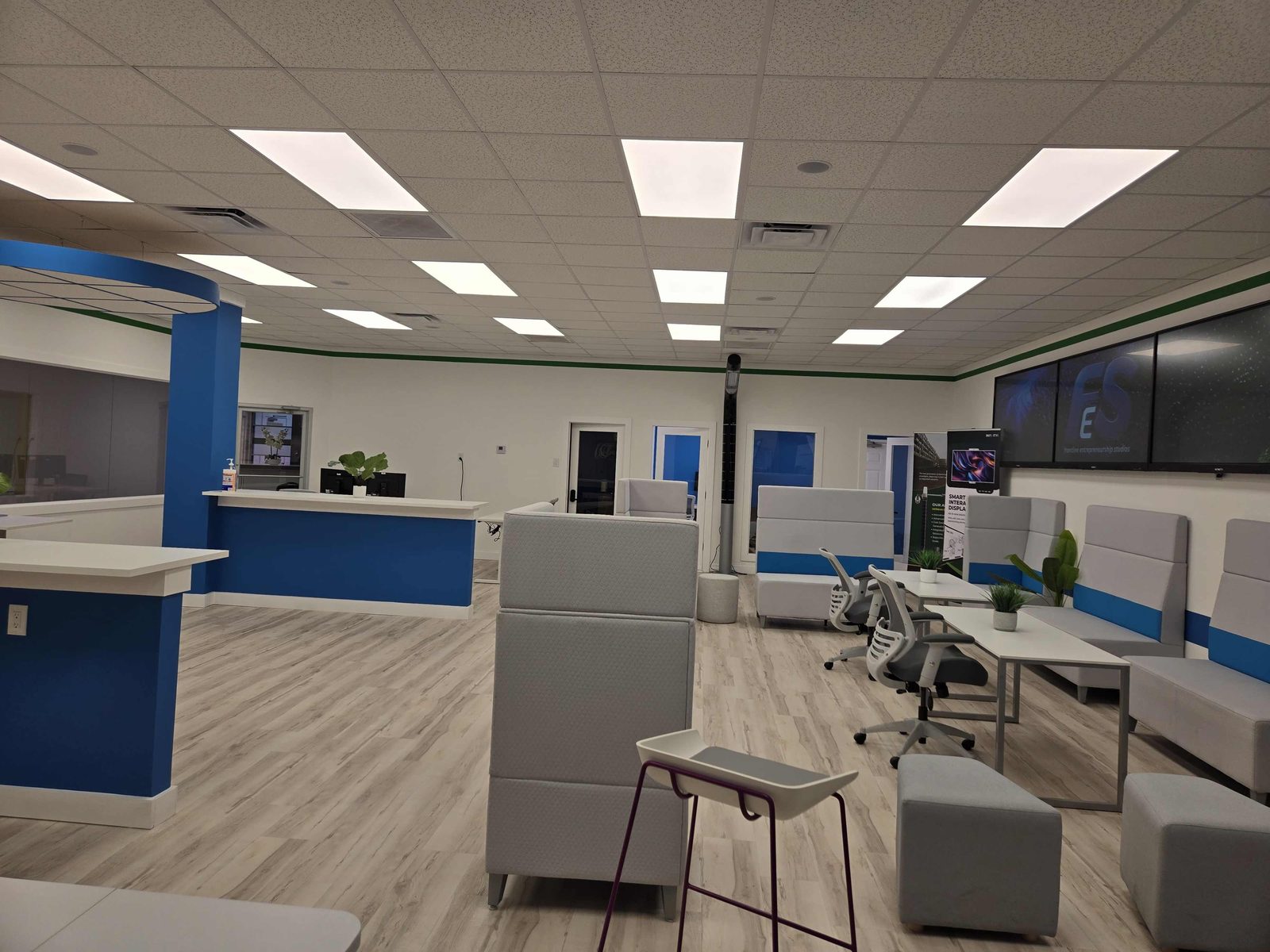 Open coworking area with reception and lounge seating